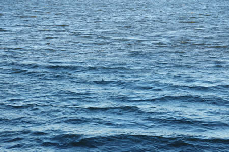 The raging waters of the river. Top view background texture of the raging elements. White foam on...