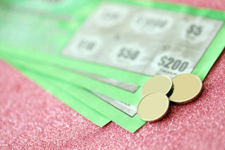 Close up view of green lottery scratch cards. Many used fake instant lottery tickets with gambling results. Gambling addiction concept.の写真素材