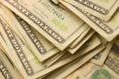 Big amount of old 20 dollar bills details on macro photography. Money earnings, payday or tax paying...