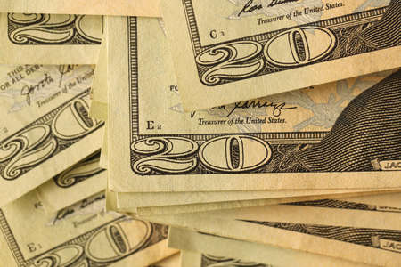 Big amount of old 20 dollar bills details on macro photography. Money earnings, payday or tax paying...