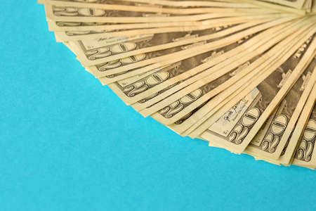 Big amount of old twenty dollar bills on blue background. Money earnings, payday or tax paying period conceptの写真素材