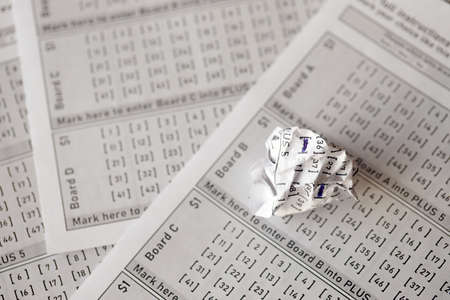 Crumpled lottery tickets as symbol of losing the lottery game. Unlucky gambling results. Misfortune...