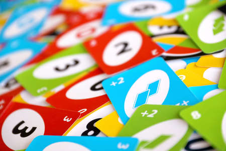 TERNOPIL, UKRAINE - MAY 15, 2022: Many colorful UNO game cards. UNO is an American shedding-type card game that is played with a specially printed deck. UNO has been a Mattel brand since 1992のeditorial素材