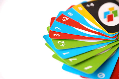 TERNOPIL, UKRAINE - MAY 15, 2022: Many colorful UNO game cards on white background close up. UNO is an American shedding-type card game that is played with a specially printed deckのeditorial素材