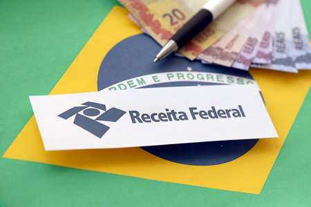 TERNOPIL, UKRAINE - MAY 20, 2022: Brazilian Receita Federal logo printed on paper. Receita Federal is the Brazilian federal revenue service agency and a secretariat of the Ministry of the Economyのeditorial素材