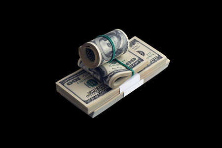 Bundle of US dollar bills isolated on black. Pack of american money with high resolution on perfect...