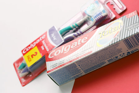 TERNOPIL, UKRAINE - JUNE 23, 2022: Colgate toothpaste and toothbrushes, a brand of oral hygiene products manufactured by American consumer-goods company Colgate-Palmolive headquartered on NYCのeditorial素材