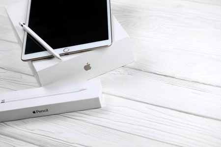 KHARKIV, UKRAINE - JANUARY 27, 2021: Brand new Apple iPad and Apple Pencil on white background....