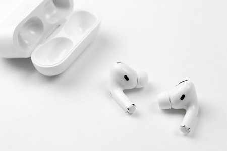 KHARKIV, UKRAINE - JANUARY 27, 2021: Apple AirPods Pro on a white background. wireless headphones. Apple Inc. is an American technology company headquartered in Californiaのeditorial素材