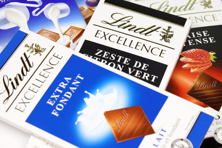 KHARKIV, UKRAINE - DECEMBER 18, 2020: Lindt Chocolate bars on white background. Lindt and Spruengli AG is a Swiss chocolatier and confectionery company known for their chocolate bars and other sweetsのeditorial素材
