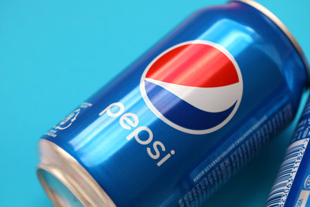 TERNOPIL, UKRAINE - MAY 28, 2022: Cold Pepsi drink cans. Pepsi is a carbonated soft drink produced...