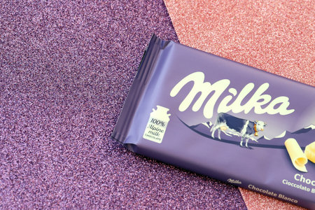 TERNOPIL, UKRAINE - JUNE 20, 2022: Milka white chocolate bar. Milka is a Swiss brand of chocolate confection manufactured internationally by company Mondelez Internationalのeditorial素材