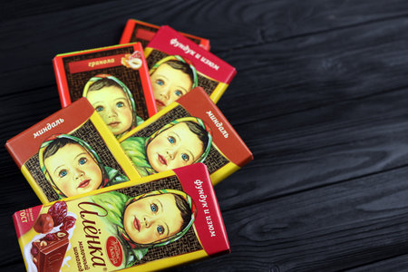 KHARKIV, UKRAINE - JANUARY 27, 2021: Alyonka chocolate square bars - product from Red October chocolate factory. old russian traditional chocolate designのeditorial素材