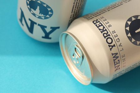 TERNOPIL, UKRAINE - JULY 18, 2022 Two cans of New Yorker fine lager beer with original logo and design on blue backgroundのeditorial素材