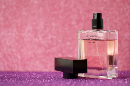 TERNOPIL, UKRAINE - SEPTEMBER 2, 2022 Narciso Rodriguez Musc Noir perfume bottle on shiny glitter...