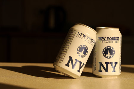 TERNOPIL, UKRAINE - JULY 18, 2022 Two cans of New Yorker fine lager beer with original logo and...