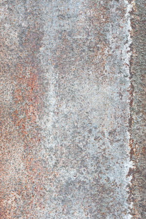 Dark worn rusty metal texture background. Very old dark orange metal sheet with damaged parts as...