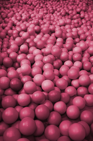 Many plastic balls in a kids ballpit at a playground. Close up pattern. Image toned in Viva Magenta, color of the 2023 yearの写真素材