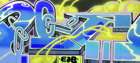 Colorful background of graffiti painting artwork with bright aerosol strips on metal wall. Old...