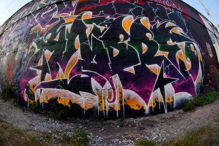 Colorful background of graffiti painting artwork with bright aerosol strips on metal wall. Old school street art piece made with aerosol spray paint cans. Contemporary youth culture backdropの写真素材