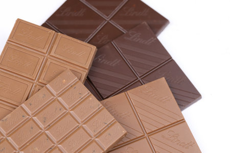 KYIV, UKRAINE - MAY 4, 2022 Lindt Swiss luxury brand chocolate brown tablets with embossed original company logo.のeditorial素材