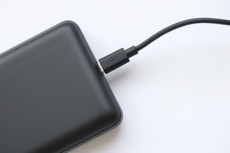 KYIV, UKRAINE - MAY 4, 2022 Portable Powerbank battery with logo of Belkin International, american...