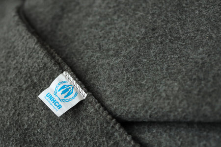 KYIV, UKRAINE - MAY 4, 2022 UNHCR The UN Refugee Agency logo on humanitarian grey blankets from humanitarian aid goodsのeditorial素材