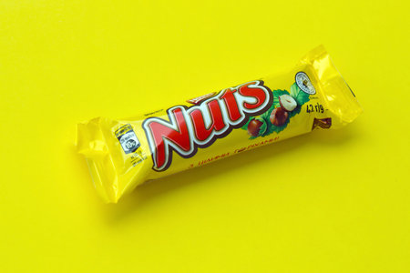 KYIV, UKRAINE - MAY 4, 2022 Nuts original chocolate bar manufactured by Nestle company. Small...