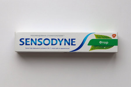 KYIV, UKRAINE - MAY 4, 2022 Sensodyne fluorine or fluor is a daily fluoride toothpaste that helps protect against tooth sensitivityのeditorial素材