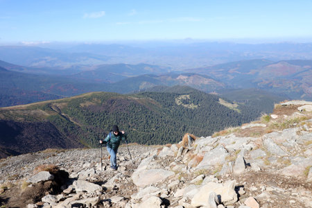 CARPATHIAN MOUNTAINS, UKRAINE - OCTOBER 8, 2022 Mount Hoverla. Carpathians in Ukraine in autumn. Tourists walks through hills and woods to climbing to the top of the Hoverla mountainのeditorial素材