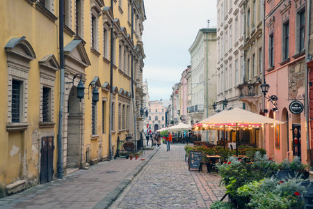 LVIV, UKRAINE - SEPTEMBER 11, 2022 Street view of the historical old city in Lviv, Ukraine. Many old buildings and facade ornaments in tight european style streets of Lvivのeditorial素材