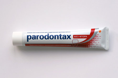 KYIV, UKRAINE - MAY 4, 2022 Package of Parodontax toothpaste on bright background close up
