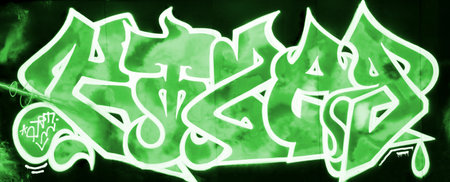 Colorful background of graffiti painting artwork with bright aerosol strips on metal wall. Old school street art piece made with aerosol spray paint cans. Contemporary youth culture backdropの写真素材