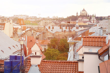 View of the roofs of historical Old city of Lviv in Ukraine. Church towers and many rusty shingled roofs in the backgroundの写真素材