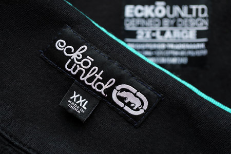 KYIV, UKRAINE - MAY 4, 2023: Ecko Unltd company logo on new brand clothes close up