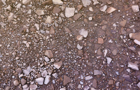Background of shattered stony stones surface in mountain area. Flat texture with natural lightの写真素材