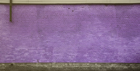 The texture of the brick wall of many rows of bricks painted in violet colorの写真素材