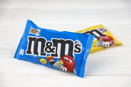 KHARKIV, UKRAINE - JANUARY 2, 2021 M and Ms colorful button shaped chocolate candies. Multi colored chocolates each of which has the letter m printed in lower case in white on one sideのeditorial素材