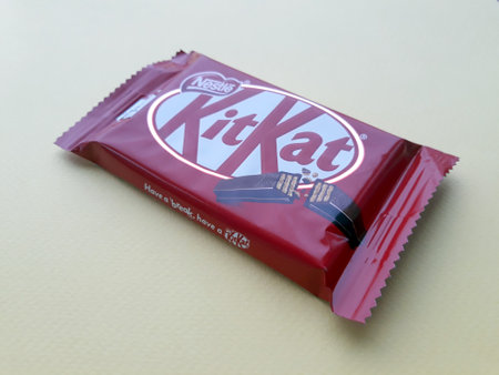 KHARKIV, UKRAINE - JANUARY 2, 2021 Kit Kat by Nestle chocolate covered wafer on bright color backgroundのeditorial素材