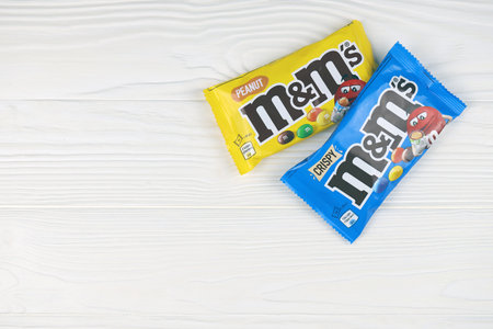 KHARKIV, UKRAINE - JANUARY 2, 2021 M and Ms colorful button shaped chocolate candies. Multi colored chocolates each of which has the letter m printed in lower case in white on one sideのeditorial素材