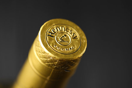 KYIV, UKRAINE - MAY 4, 2022 Hennessy Very Special original alcohol bottle on black wooden table. Elite alcohol productionのeditorial素材