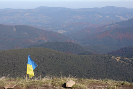 Ukrainian flag on top of Hoverla mountain in Ukraine close upの写真素材