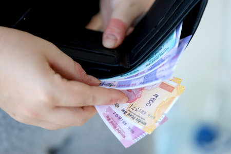 Woman hand with indian rupees bills close up. Concept of financial operations in cash in India