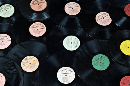 KYIV, UKRAINE - 4 MAY, 2023: Vinyl LP records from 1950-1970. Old Soviet songs on worn gramophone records close upのeditorial素材