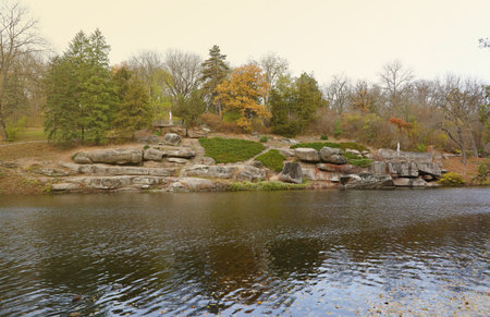 Beautiful Nature Autumn landscape with lake. Scenery view on autumn city park with golden yellow...
