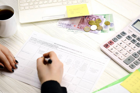 Accountant fill french tax form 2041E Withholding tax declaration in end of tax period. Taxation and paperwork routine in Franceの写真素材