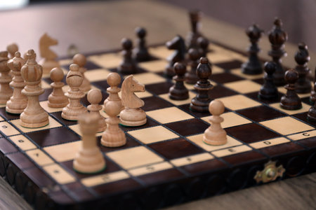 The chess board with the pieces in the dark vintage room interiorの写真素材