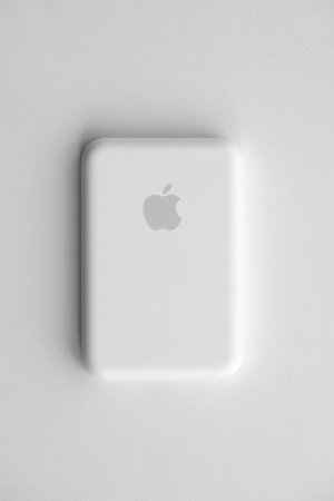 KYIV, UKRAINE - OCTOBER 31, 2023 Apple MagSafe battery device for iPhone charging via magnet connection. Mag Safe modern portable power bank deviceのeditorial素材