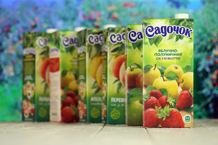 KHARKIV, UKRAINE - JANUARY 2, 2021 Sadochok various taste nectar from peach, apple and strawberry with orange flavour juice tetra packsのeditorial素材