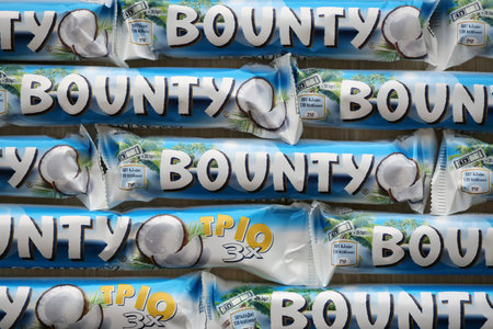 KYIV, UKRAINE - OCTOBER 31, 2023 Bounty chocolate bars with cocoa flavor filling. Bounty chocolate bar is a brand of American Mars Inc companyのeditorial素材